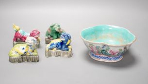 Four Chinese polychrome glazed models of lion-dogs, Republic period and a Chinese famille rose dish,