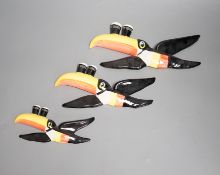 A graduated set of three Carlton ware toucan wall plaques