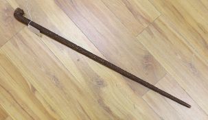 An Asian carved wood walking cane,7 cm long.