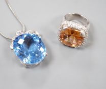 A modern 925 and paste set dress ring and a blue and white paste cluster set pendant on chain.