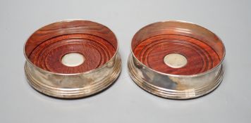 A pair of modern silver mounted wine coasters, B & Co, London,1996, diameter 11.9cm.