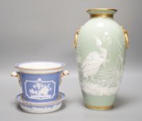 A Royal Worcester pate sur pate 'heron' vase and an early 19th century plant pot and under dish.