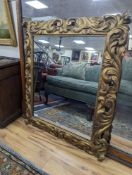 A 19th century French carved giltwood wall mirror with acanthus scroll frame, width 91cm, height