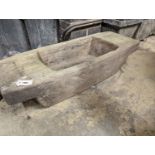 A Continental carved wood trough, width 112cm, depth 44cm