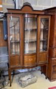 An Edwardian inlaid mahogany bow fronted display cabinet, width 114cm, depth 42cm, height 209cm