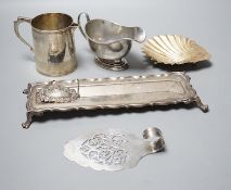A George V silver sauceboat, an Edwardian silver pen tray and three other items including shell