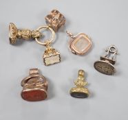 Six assorted Victorian and later mainly carnelian set fob seals including yellow metal overlaid