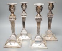 A set of four late Victorian silver candlesticks, with fluted, tapered stems, Hawksworth, Eyre & Co,