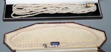 A single strand cultured pearl necklace, with sterling clasp, 44.5cm and a quadruple strand