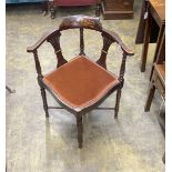 An Edwardian inlaid mahogany corner elbow chair
