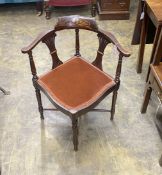 An Edwardian inlaid mahogany corner elbow chair