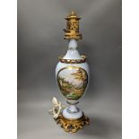 A French 19th century porcelain and ormolu oil lamp (later converted to an eclectic lamp),54 cms