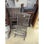 Five weathered teak folding garden chairs, three with arms