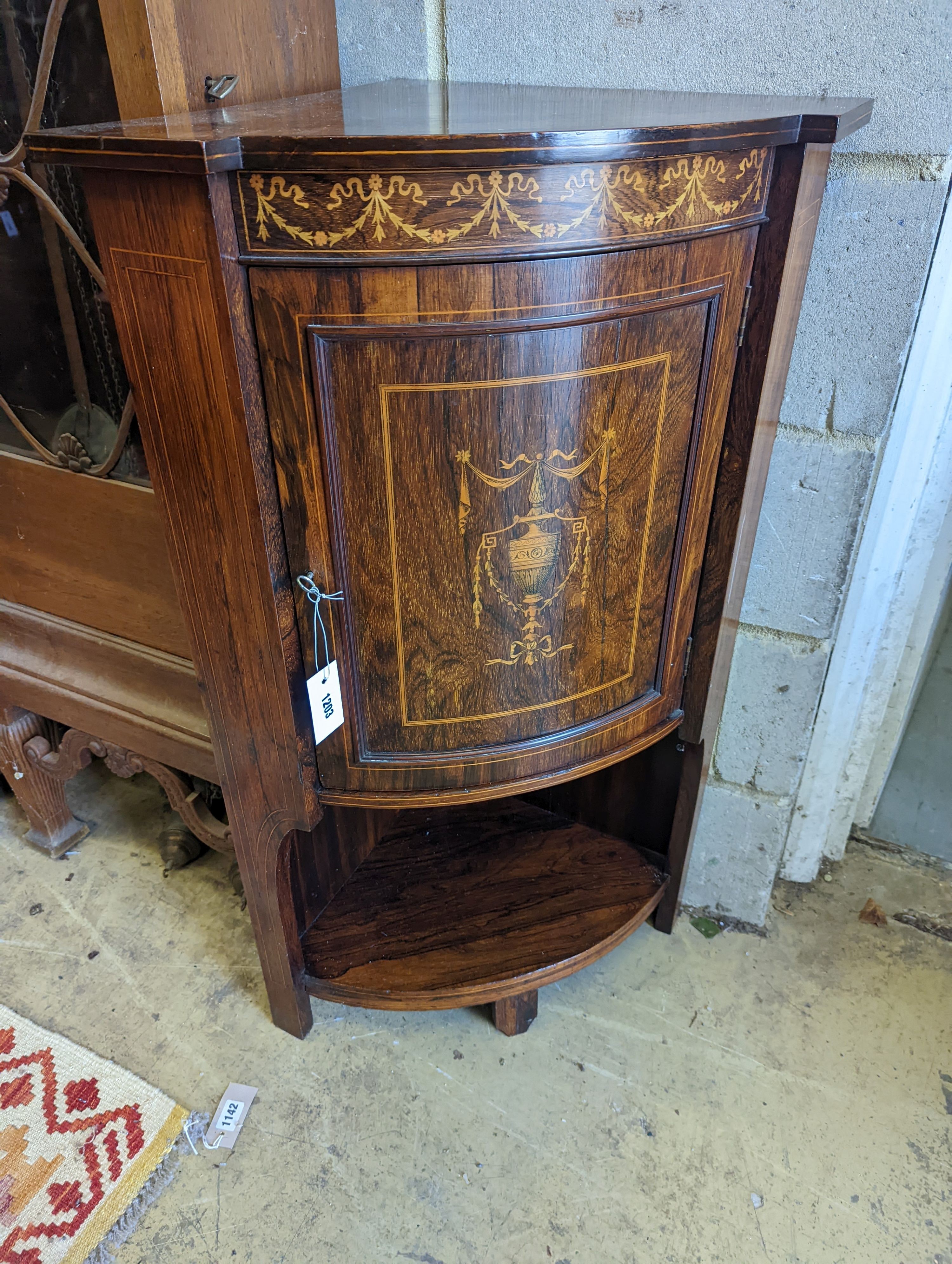 An Edwardian marquetry inlaid rosewood bowfront corner cupboard, width 61cm, depth 43cm, height