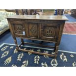 An 18th century style carved oak two door side cabinet, width 107cm, depth 35cm, height 86cm