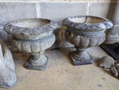 A pair of reconstituted stone circular campana garden urns, diameter 34cm, height 36cm