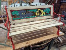 A painted metal child's garden bench, width 85cm, height 52cm