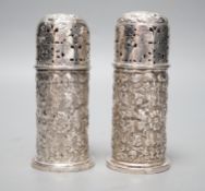 A pair of late Victorian embossed silver small lighthouse pepperettes, Horace Woodward & Co, London,