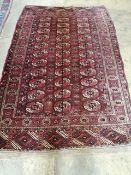 A Bokahra red ground rug, 205 x 120cm