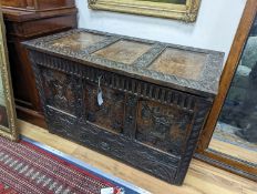 An 18th century oak mule chest with later carved decoration, length 103cm, depth 53cm, height 66cm