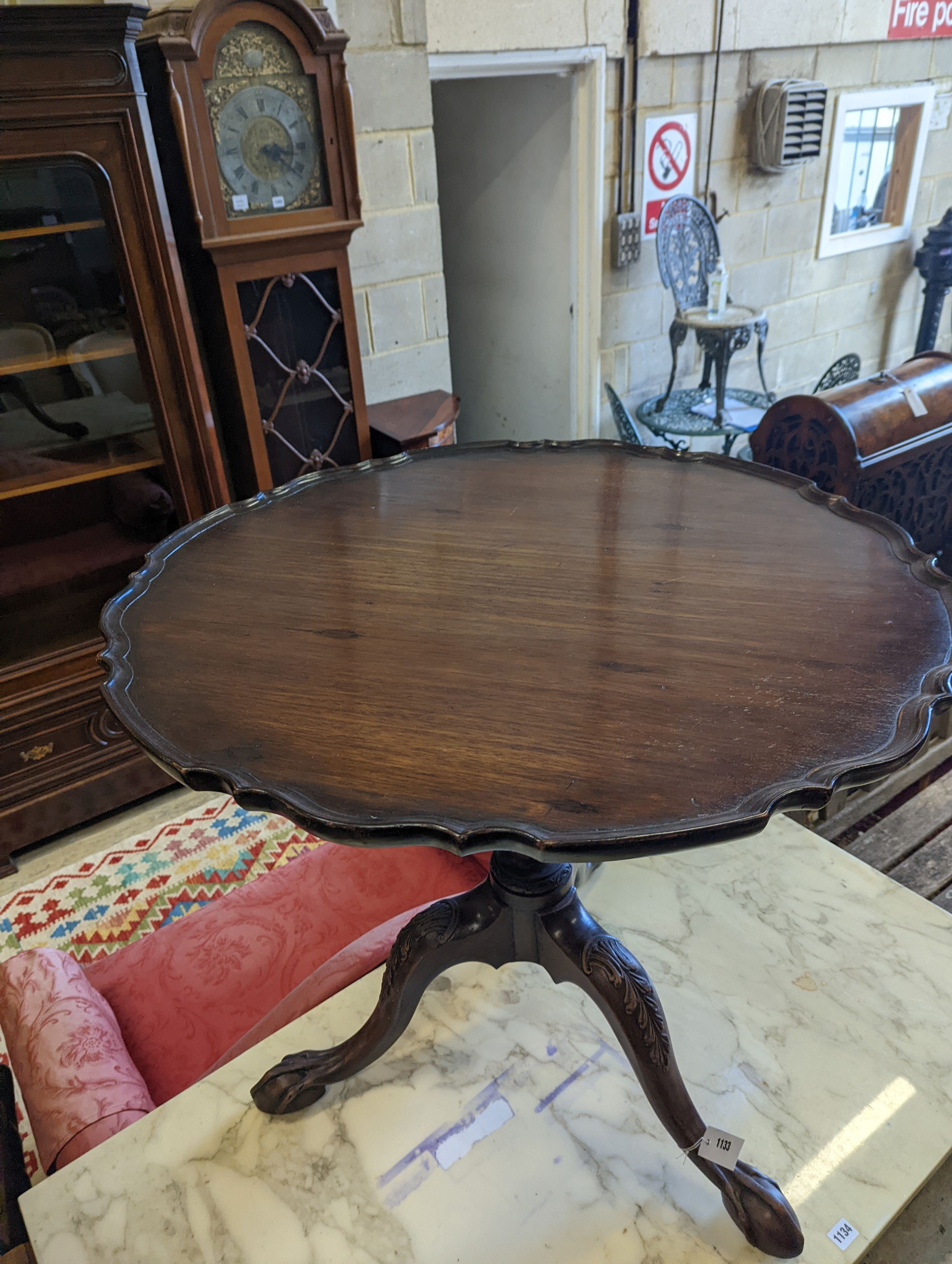 A George III style circular mahogany tripod table, with piecrust top and claw and ball feet, - Image 5 of 6