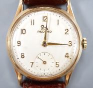 A gentleman's 9ct gold Record manual wind wrist watch, on a brown leather strap, case diameter