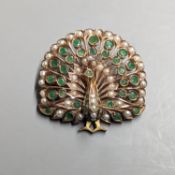 An Indian? gilt metal emerald and seed pearl cluster set peacock pendant brooch, height 45mm.