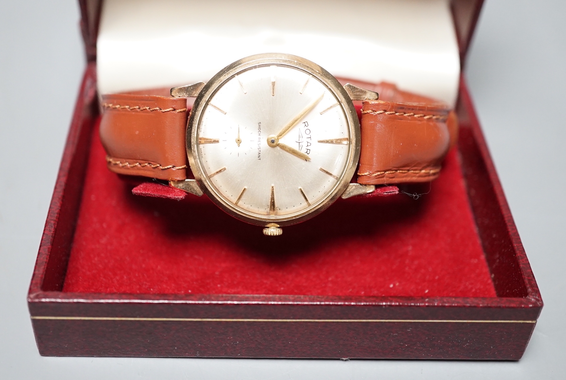 A gentleman's 9ct gold Rotary shock resisting manual wind wrist watch, on a brown leather strap,