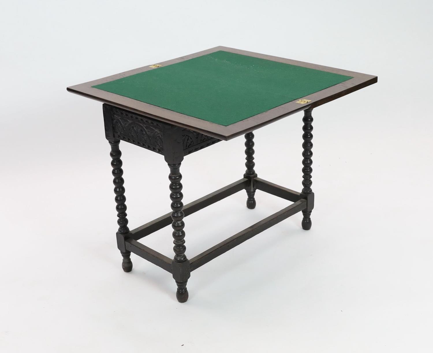 An early 20th century Jacobean revival rectangular carved oak folding card table, on bobbin turned - Image 3 of 3