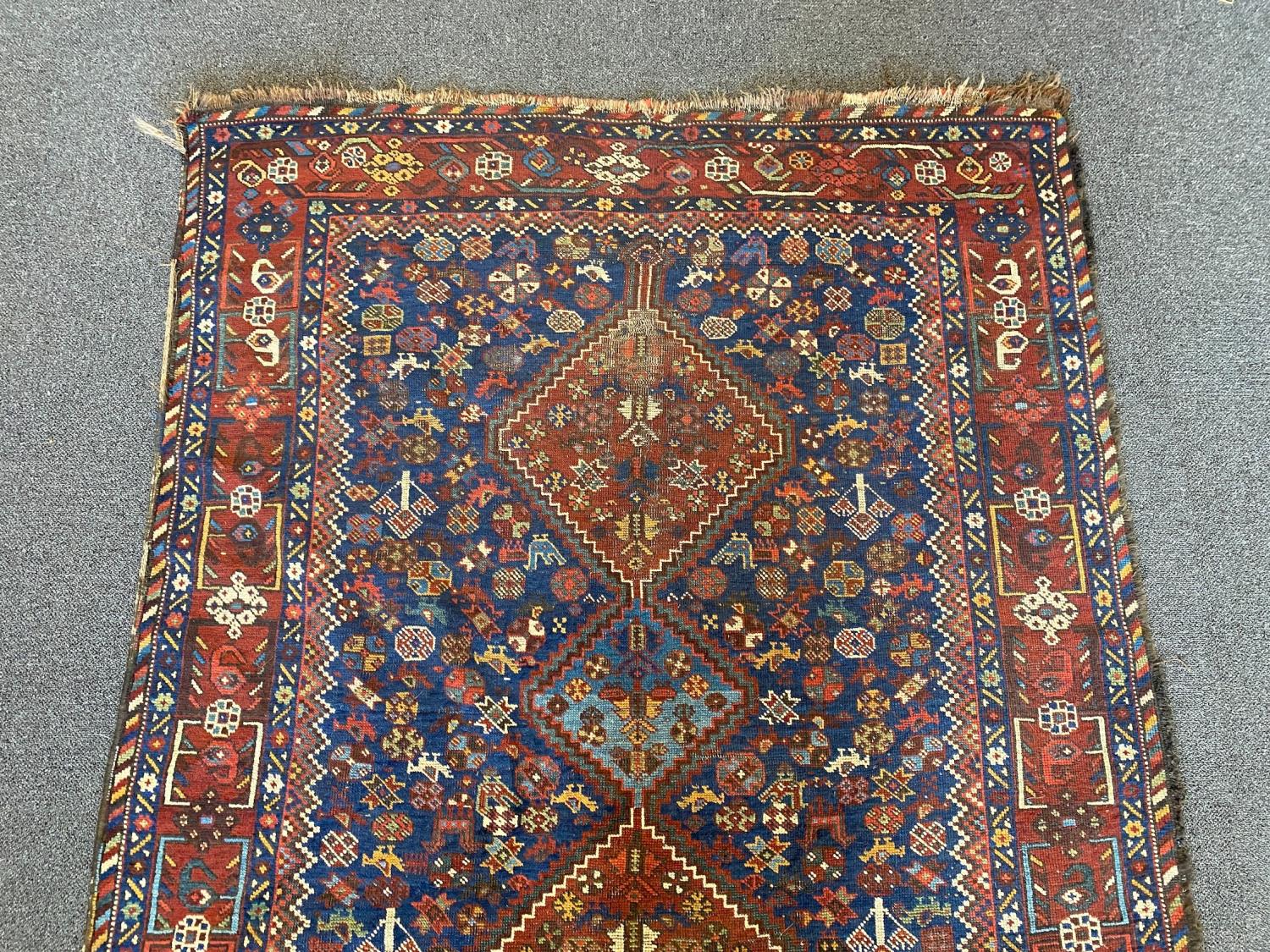 A Shiraz blue ground rug with triple lozenge medallion and floral border 160 x 122 cms. - Image 3 of 4