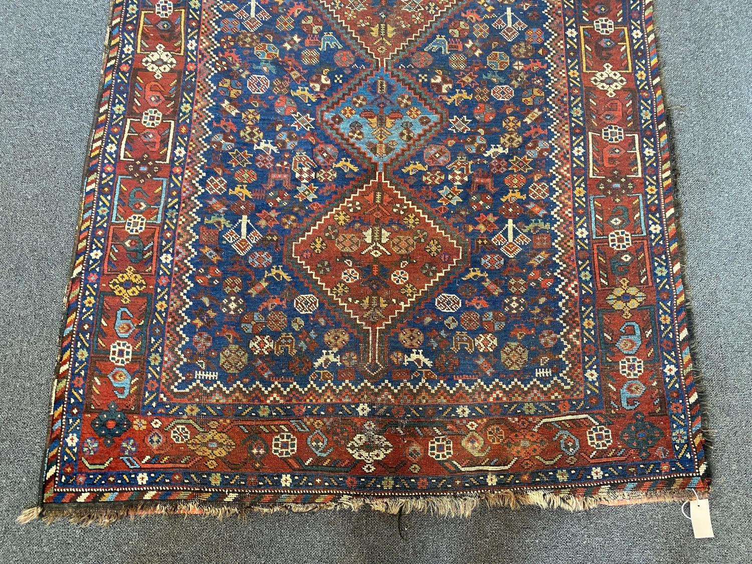 A Shiraz blue ground rug with triple lozenge medallion and floral border 160 x 122 cms. - Image 2 of 4