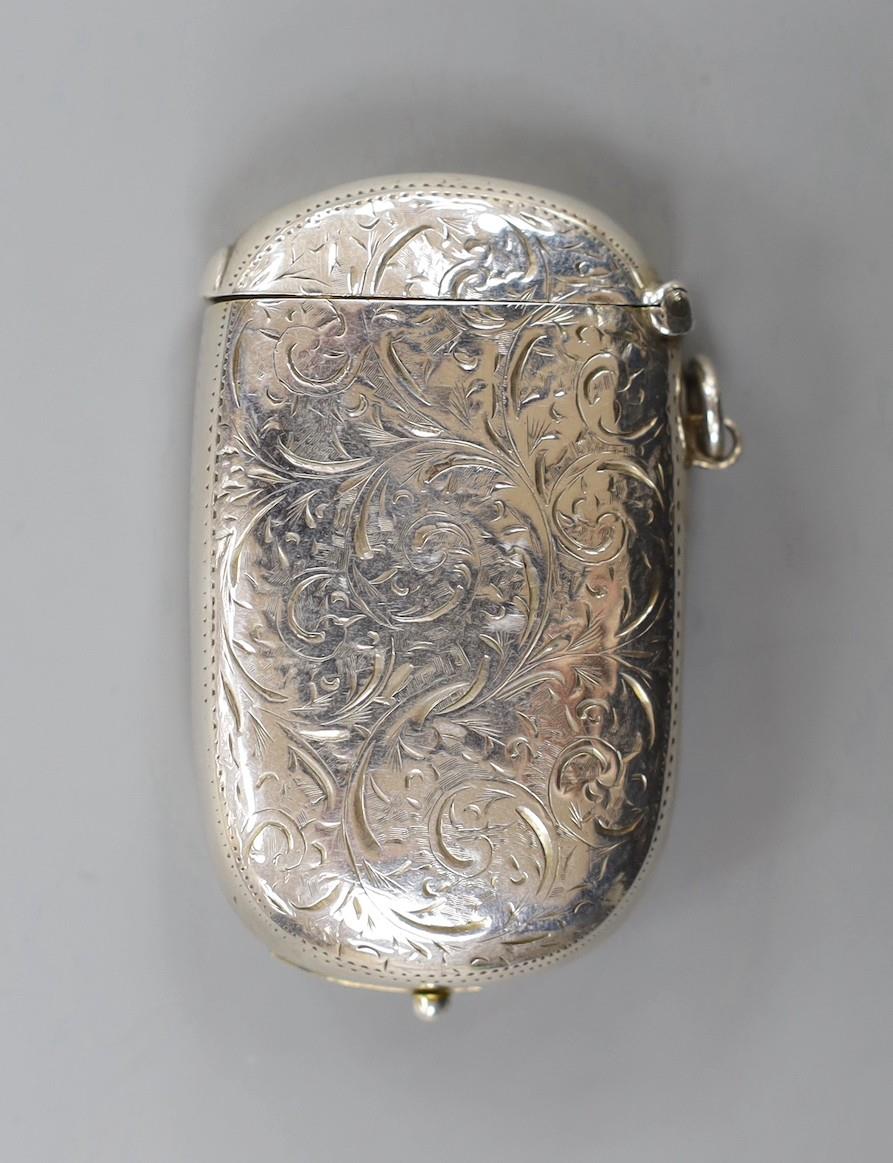 A late Victorian engraved silver combination sovereign and vesta case, the interior with removable
