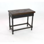 An early 20th century Jacobean revival rectangular carved oak folding card table, on bobbin turned