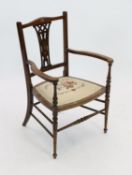 An Edwardian inlaid mahgany elbow chair