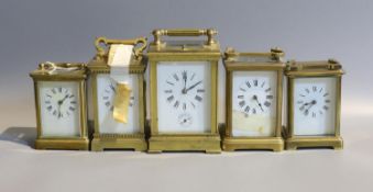 Five early 20th century and later lacquered brass carriage clocks and timepieces, in varying