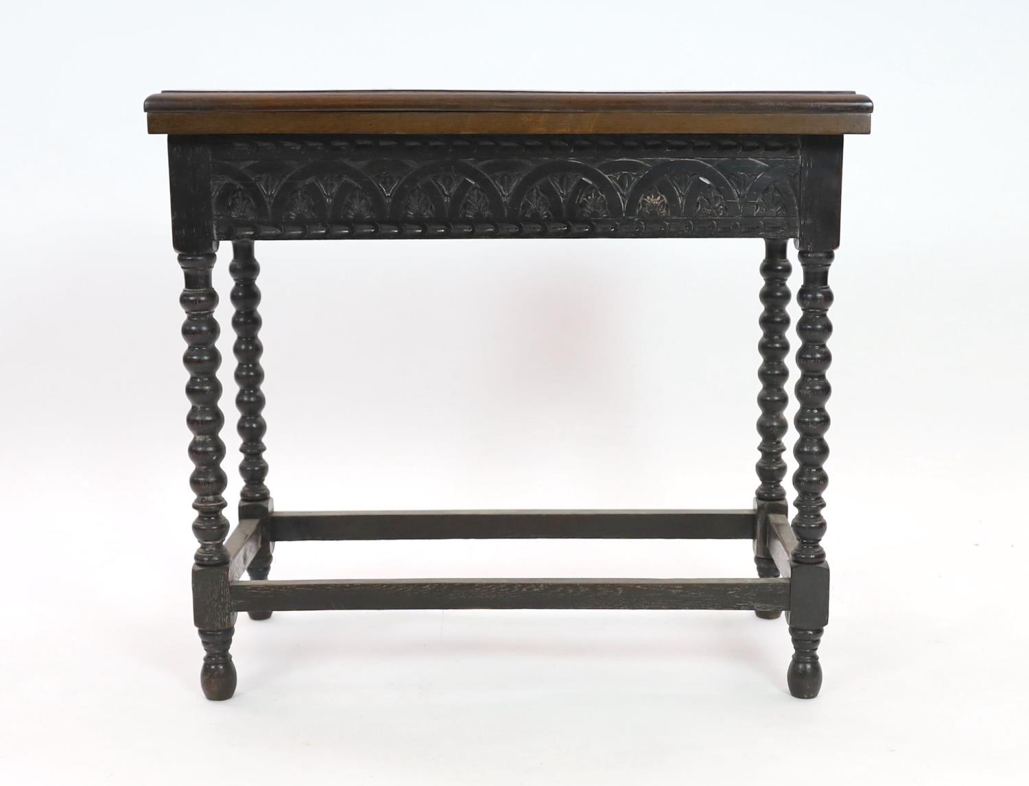 An early 20th century Jacobean revival rectangular carved oak folding card table, on bobbin turned - Image 2 of 3