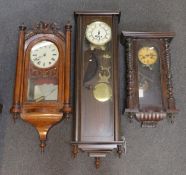 A late 19th century American carved inlaid walnut drop dial wall clock, height 94 cms together