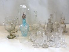 A collection of 19th century and later decanters, drinking glasses, oil bottles etc.