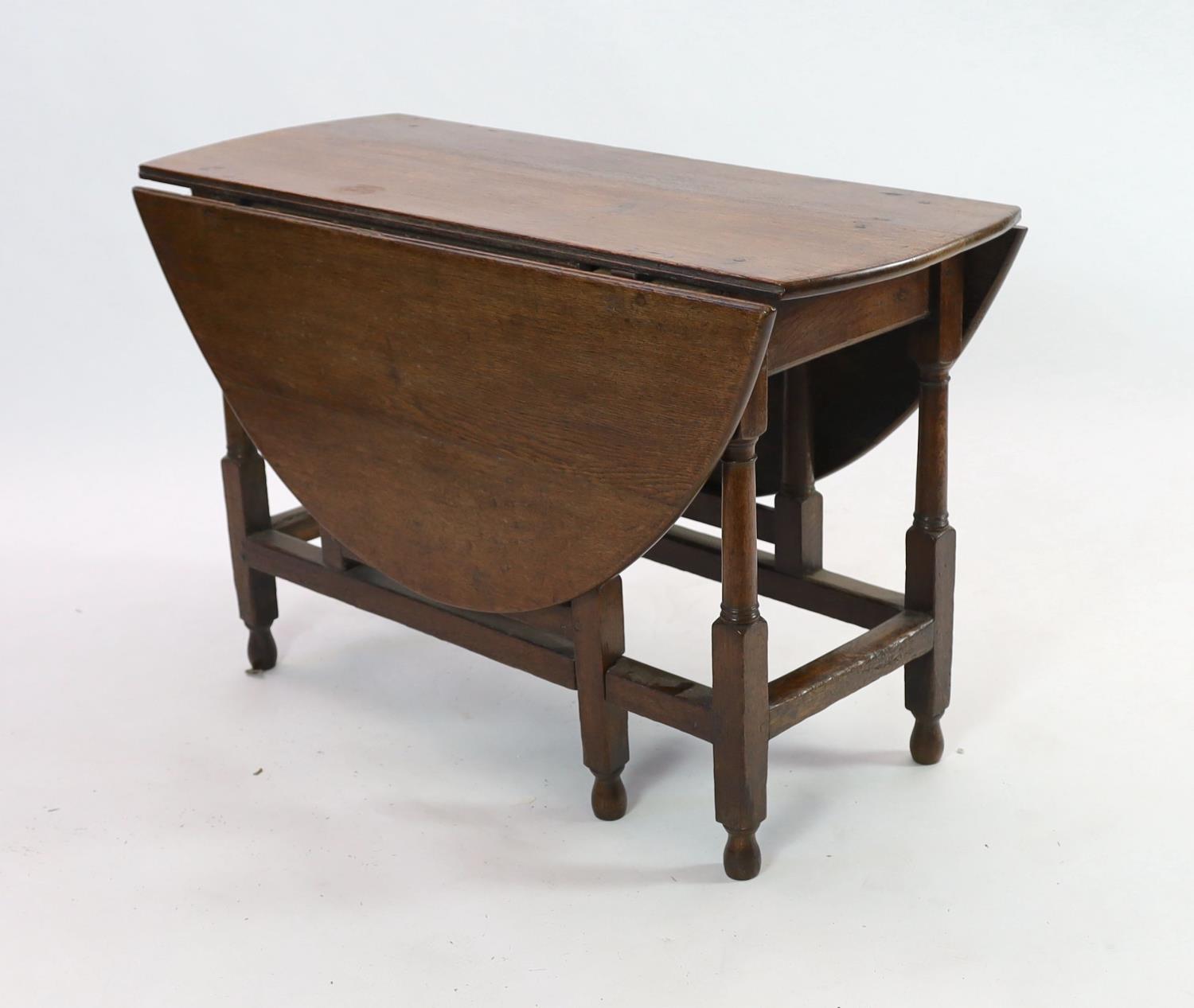 An 18th century oak gateleg dining table, 140cm extended, width 51cm height 75cm