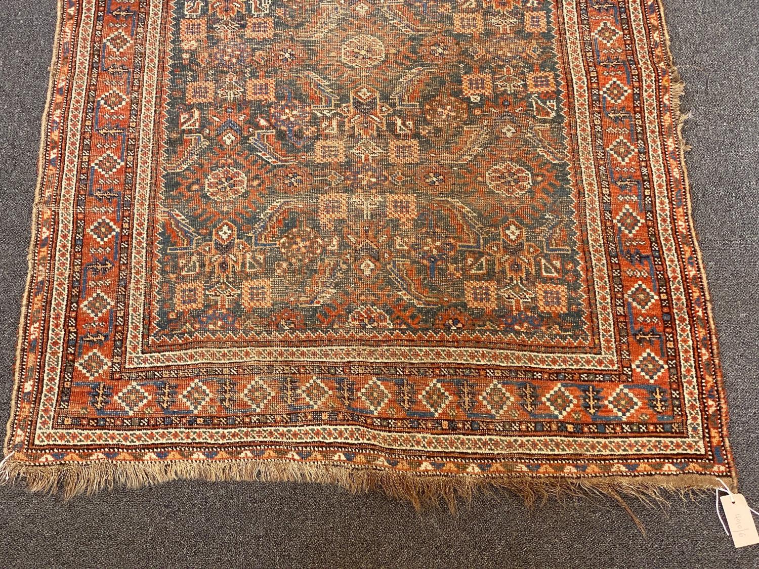 A Shiraz blue ground rug with dense floral field (worn), 144 x 102 cms - Image 2 of 4