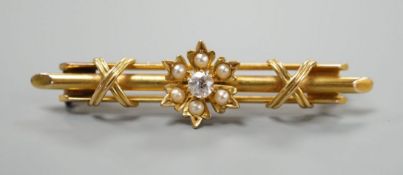 A Victorian 15ct, diamond and seed pearl set flower head bar brooch, 44mm, gross weight 4.3 grams.