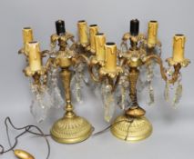 A pair of brass 4 branch, 5 light candelabra with cut glass lustre drops, 30cm