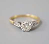 An 18ct & plat, single stone diamond ring, with diamond set shoulders, size N, gross weight 2.7