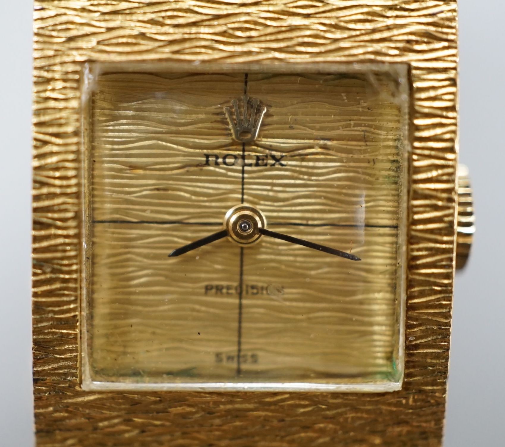 A lady's 1960's textured 18ct gold Rolex Precision manual wind bracelet watch, case diameter 17mm,