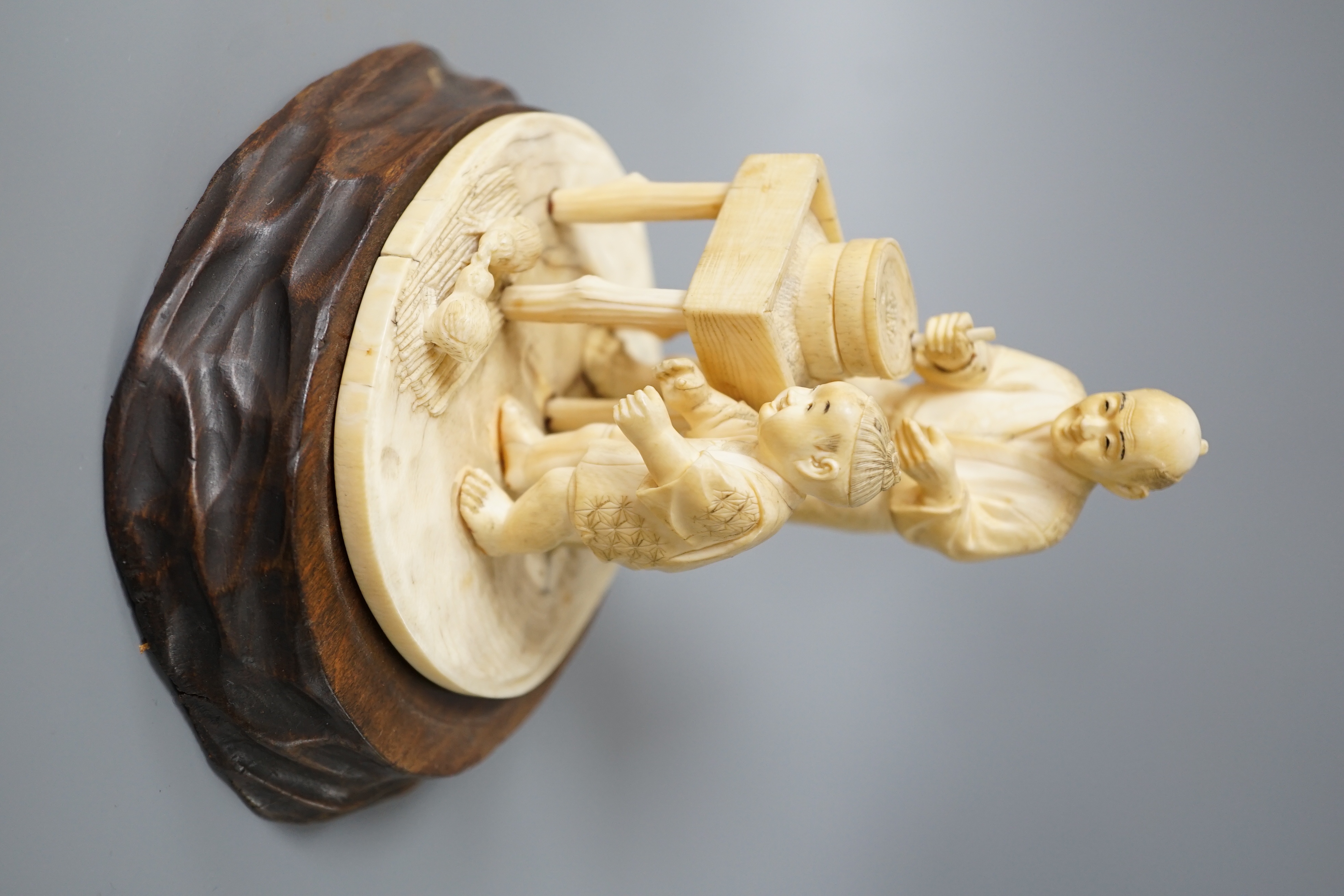A Japanese ivory okimono of man and boy at a grindstone, Meiji period, signed, wood stand. 15cm - Image 2 of 6