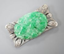 A white metal (stamped 9C?), diamond chips and oval carved jade set shaped rectangular brooch, 52mm,