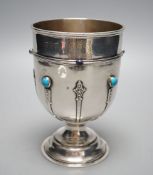 A George V silver goblet or pedestal cup with inset cabochon turquoise and cabochon lapis lazuli,
