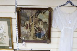 A framed Victorian woolwork panel depicting figures around a tree - 46 x 40cm