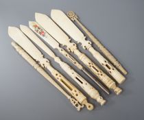 Four Victorian bone Stanhope paper knives, and three other bone items