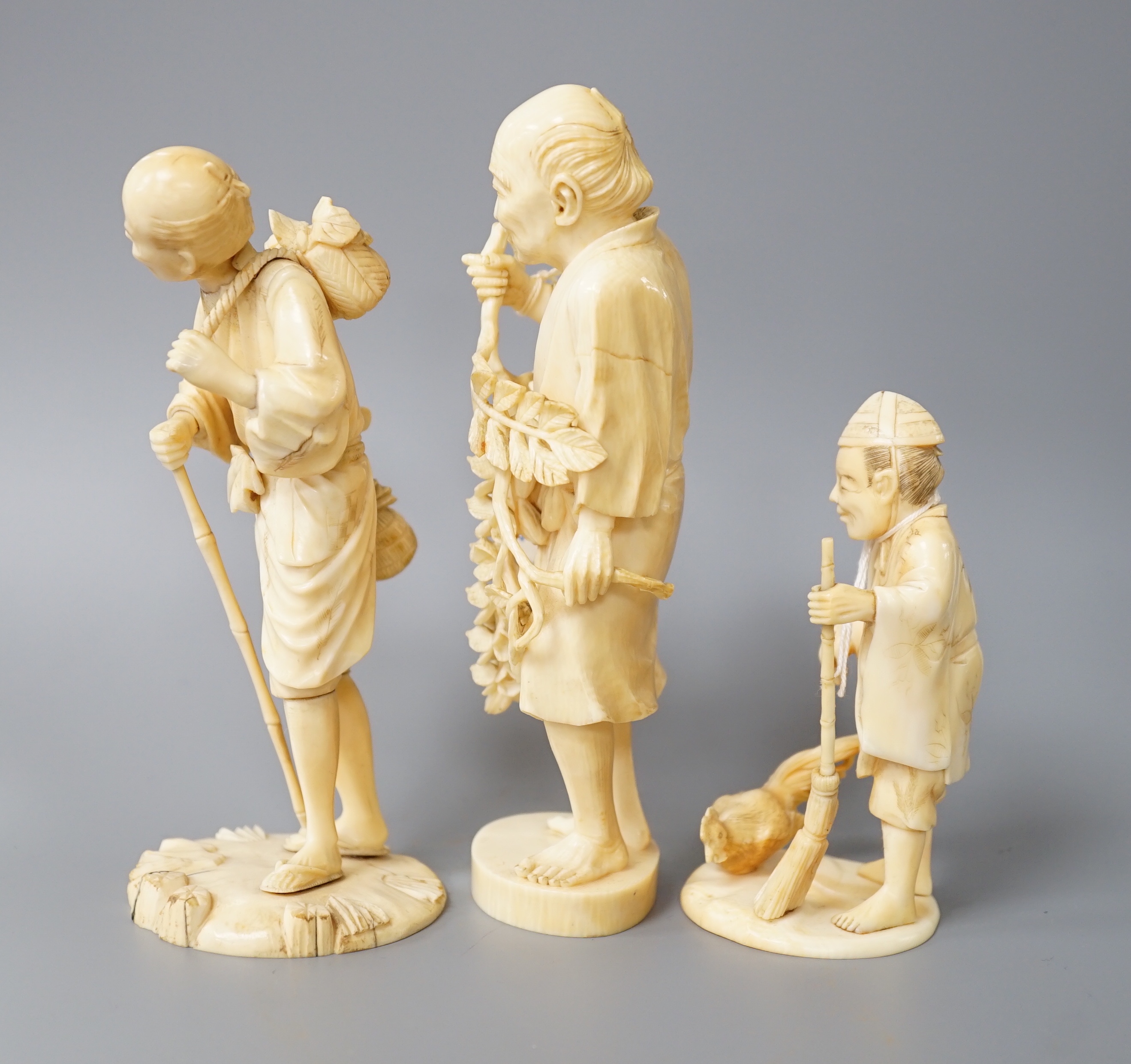A 19th century Japanese ivory okimono of a gentleman holding a branch, another sectional figure of a - Image 5 of 6